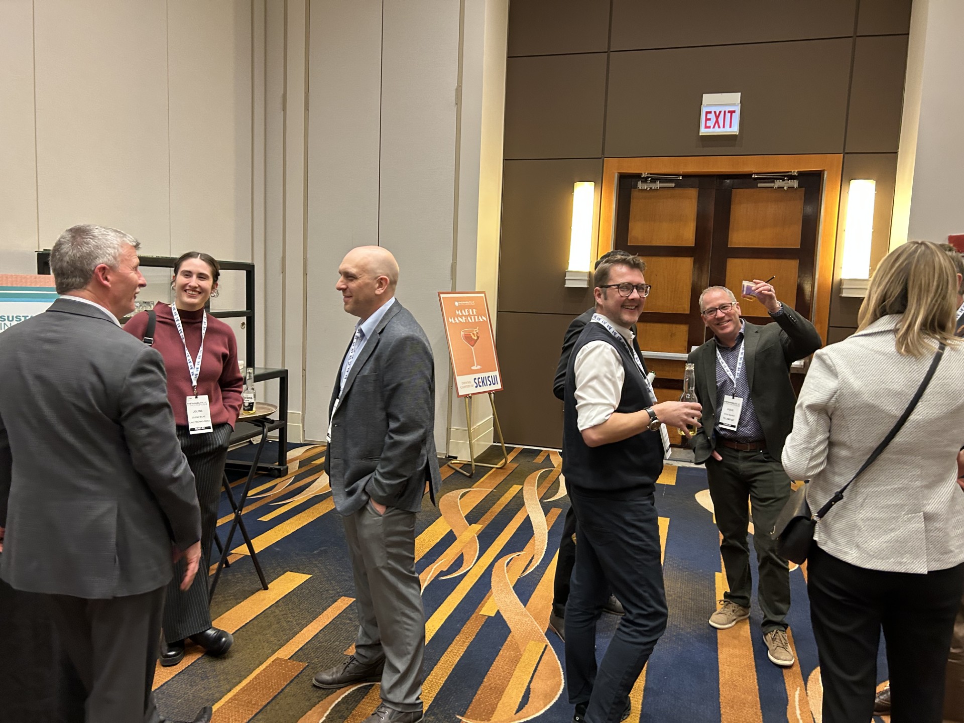 Networking in front of sign